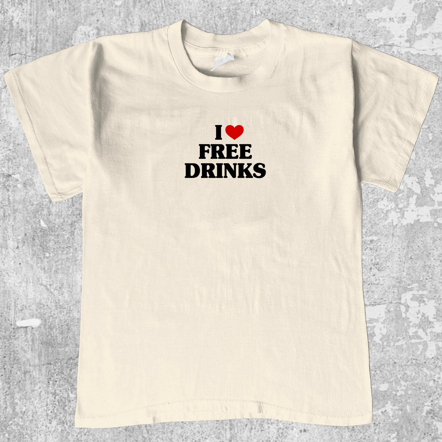 I Love Free Drinks graphic tee with bold and humorous print, funny and trendy graphic. Perfect gifts for friends and family. Cream shirt.