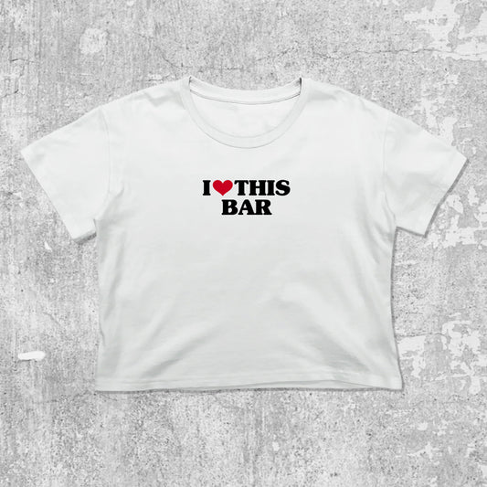 I Love This Bar graphic crop tee with cute and trendy fit, featuring playful vintage graphic, stylish cut. White crop t-shirt