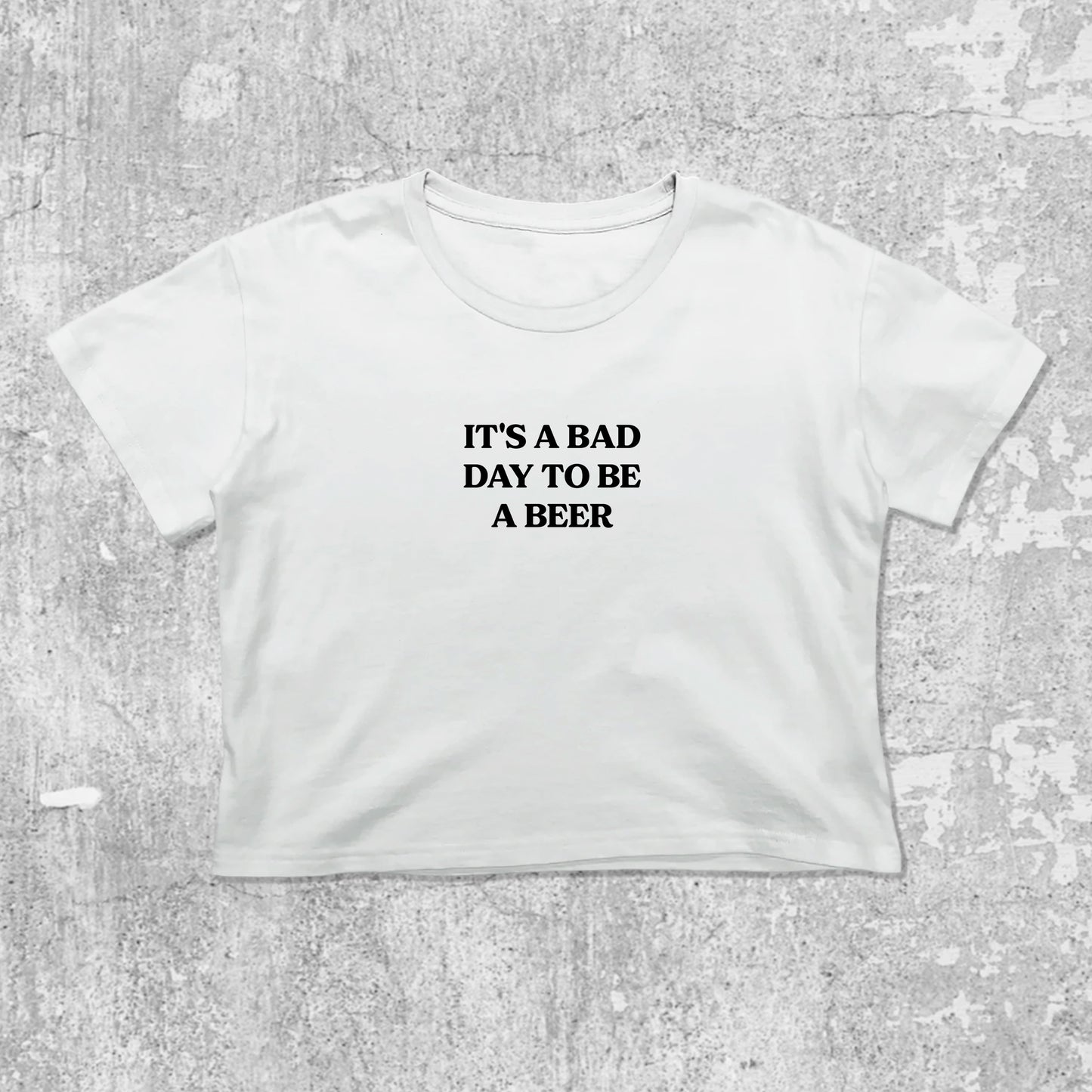 It's A Bad Day To Be A Beer graphic crop tee with cute and trendy fit, featuring playful vintage graphic, stylish cut. White crop t-shirt