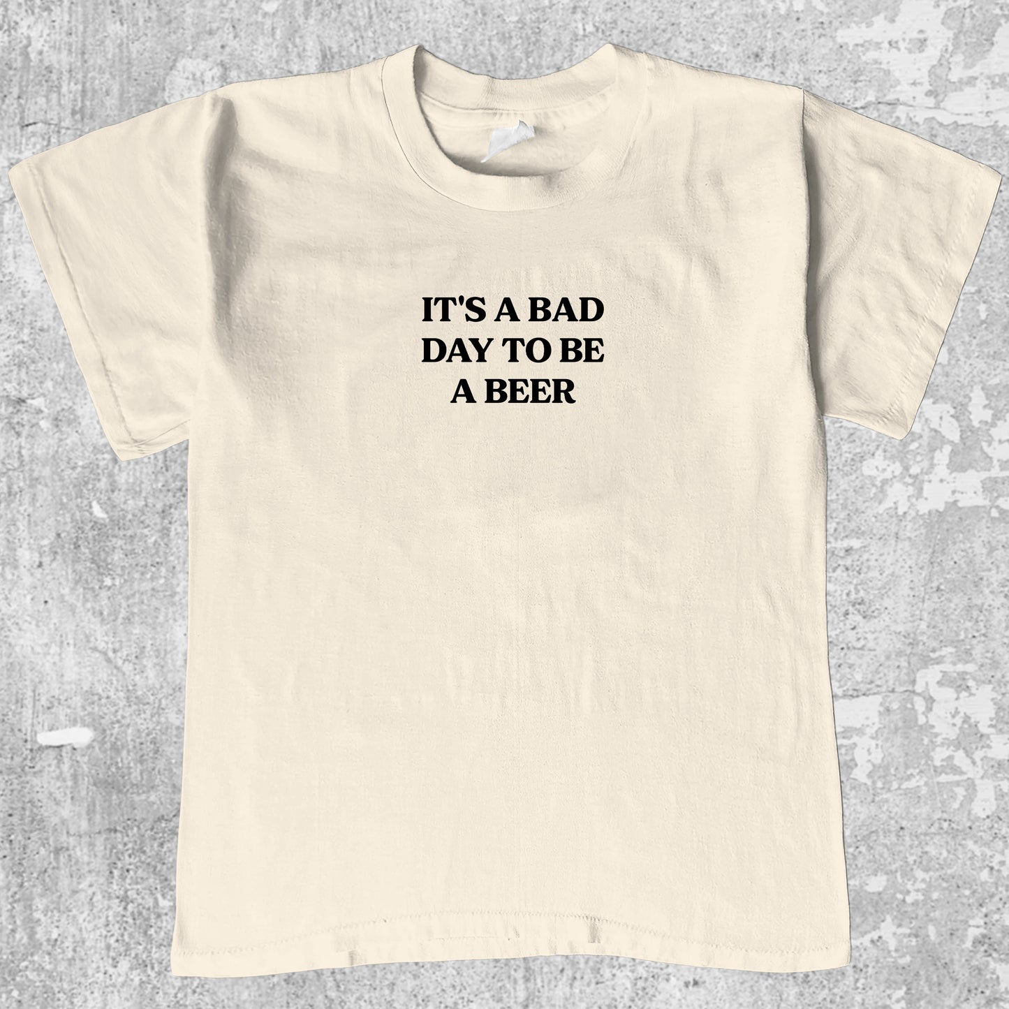 It's A Bad Day To Be A Beer graphic tee with bold and humorous print, funny and trendy graphic. Perfect gifts for friends and family. Cream shirt.