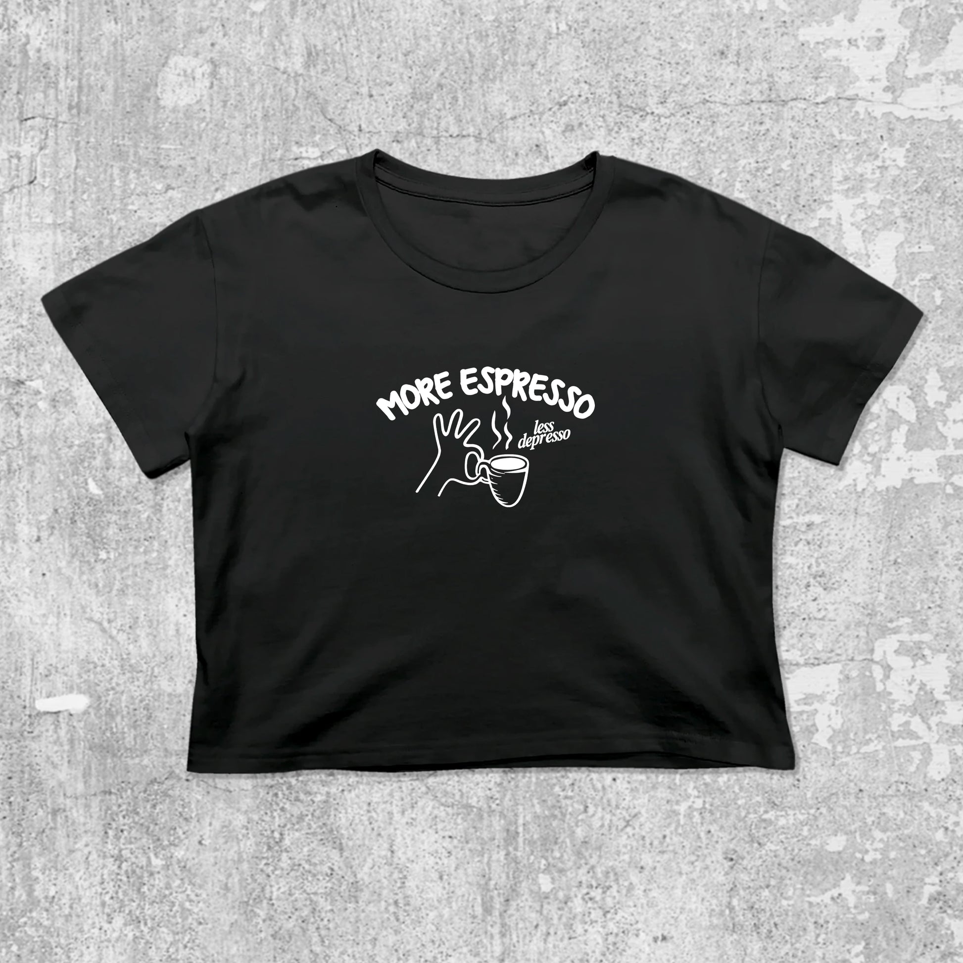 More Espresso Less Depresso graphic crop tee with cute and trendy fit, featuring playful coffee graphic, stylish cut. Black crop t-shirt