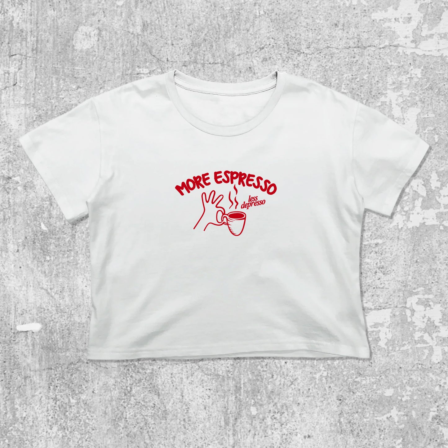 More Espresso Less Depresso graphic crop tee with cute and trendy fit, featuring playful coffee graphic, stylish cut. White crop t-shirt