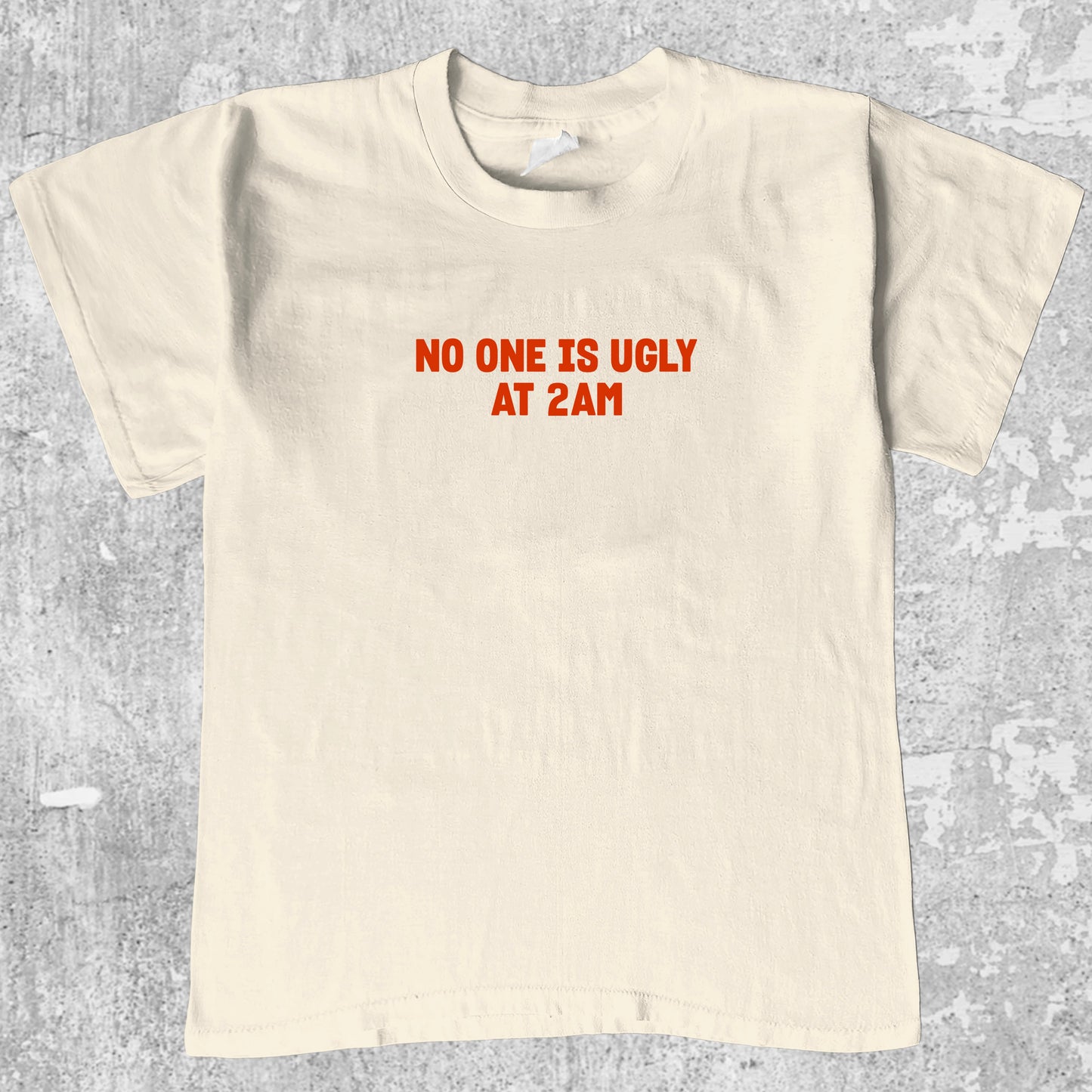 No one is ugly at 2am graphic tee with bold and humorous print, funny and trendy graphic. Perfect gifts for friends and family. Cream shirt.