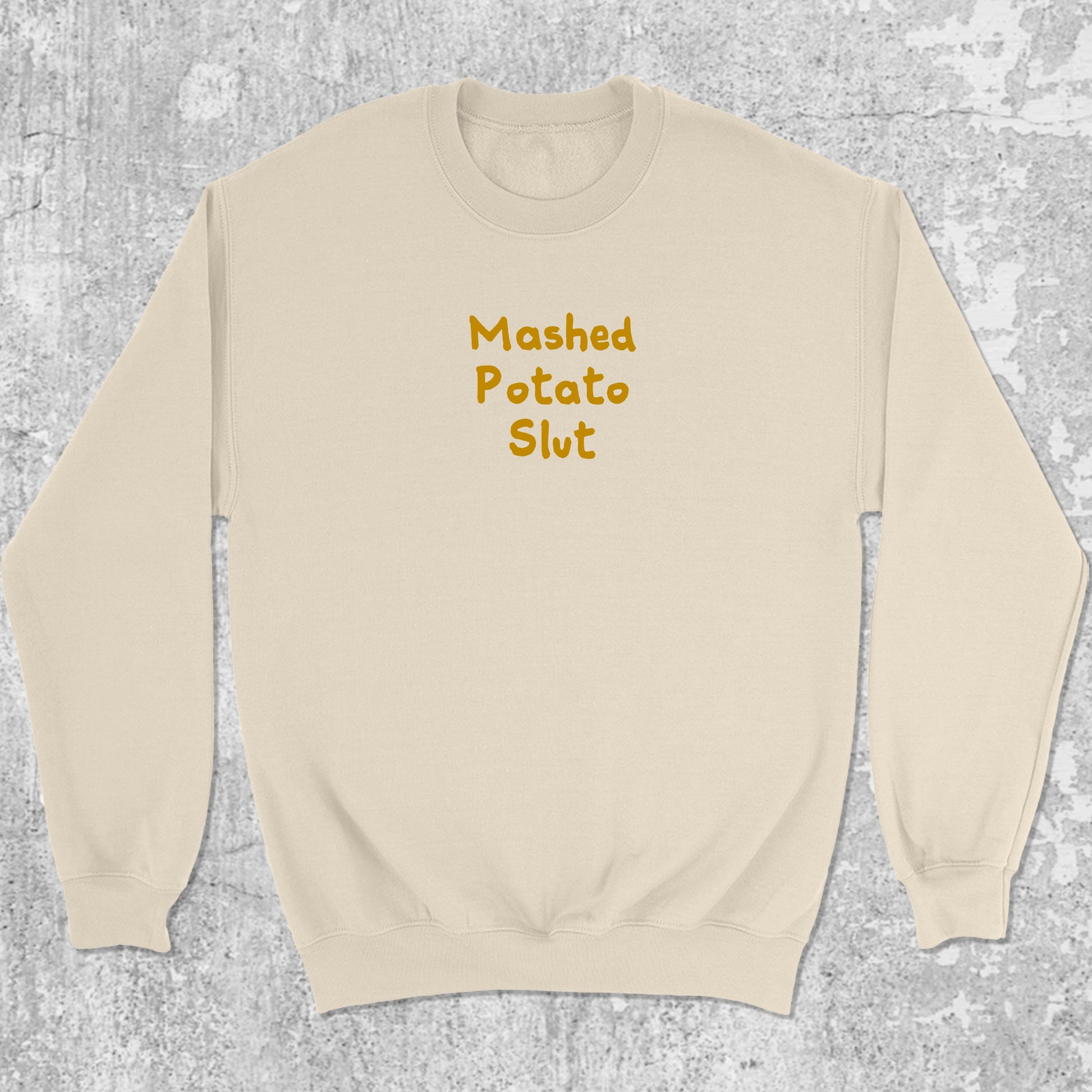 Mashed Potato Slut graphic sweatshirt with bold and humorous print, warm and cozy graphic for everyday wear. Perfect for Christmas gifts for friends and family. Natural pullover.