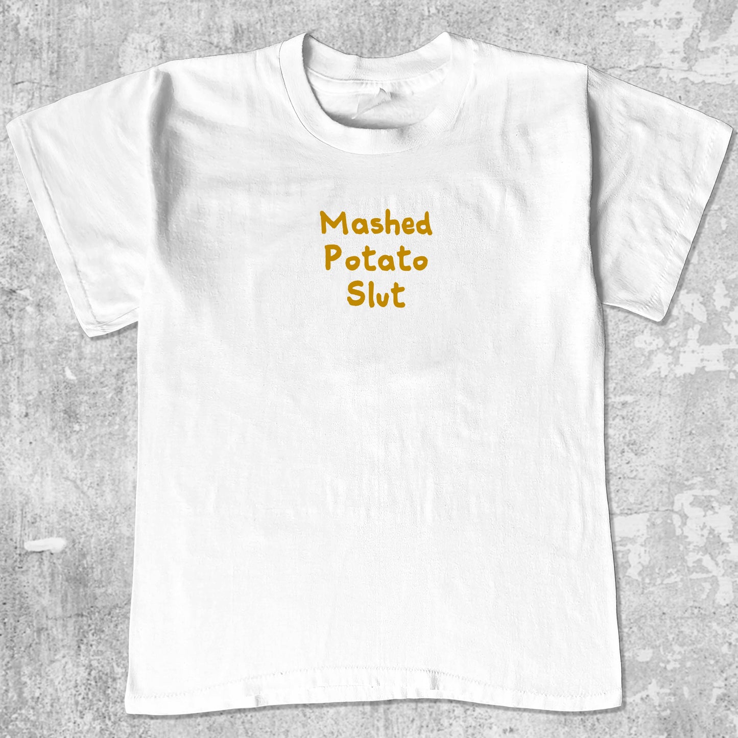Mashed Potato Slut graphic tee with bold and humorous print, funny and trendy graphic. Perfect for Christmas gifts for friends and family. White shirt.