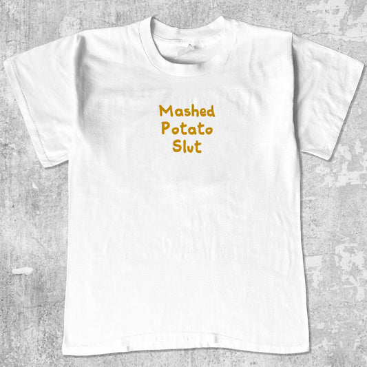 Mashed Potato Slut graphic tee with bold and humorous print, funny and trendy graphic. Perfect for Christmas gifts for friends and family. White shirt.