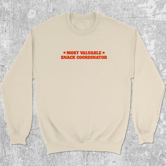Most valuable snack coordinator graphic sweatshirt with bold and humorous print, warm and cozy graphic for everyday wear. Perfect for adults and gift-giving. Natural pullover.