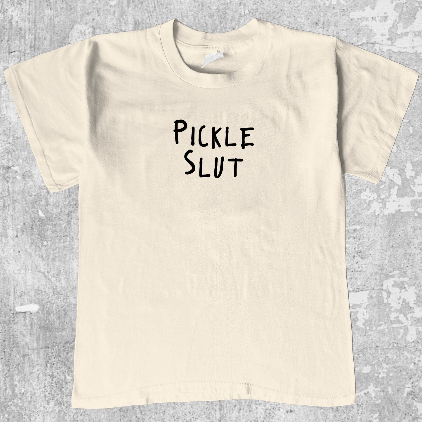 Pickle Slut graphic tee with funny pickle print, funny and trendy graphic. Perfect for friends. Cream shirt.