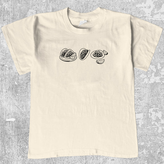 Tacos graphic tee with bold and humorous print, funny and trendy graphic. Perfect gifts for friends and family. Cream shirt.