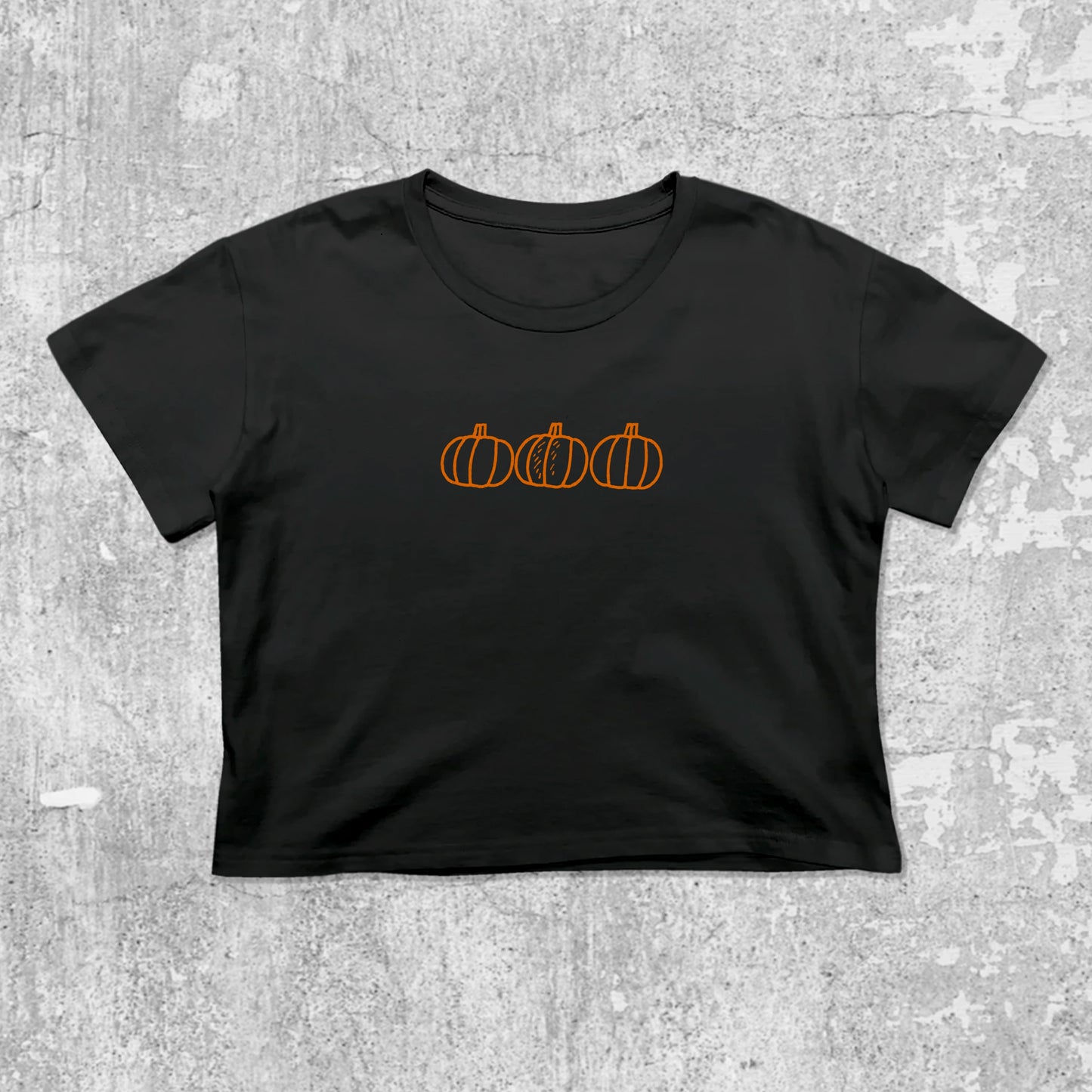 Pumpkins graphic crop tee with cute and trendy fit, featuring playful vintage graphic, stylish cut. Black crop t-shirt