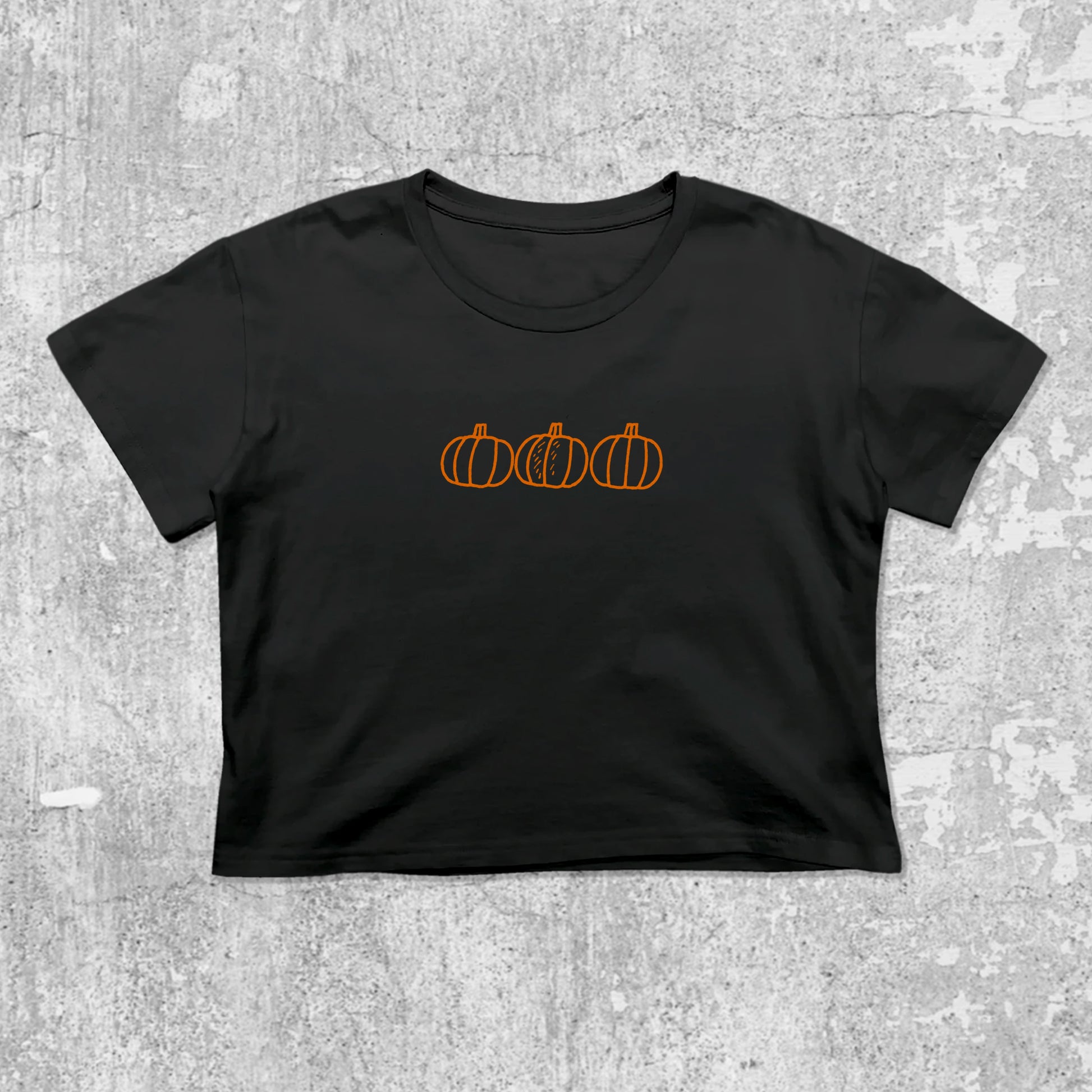 Pumpkins graphic crop tee with cute and trendy fit, featuring playful vintage graphic, stylish cut. Black crop t-shirt