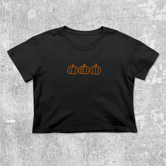 Pumpkins graphic crop tee with cute and trendy fit, featuring playful vintage graphic, stylish cut. Black crop t-shirt