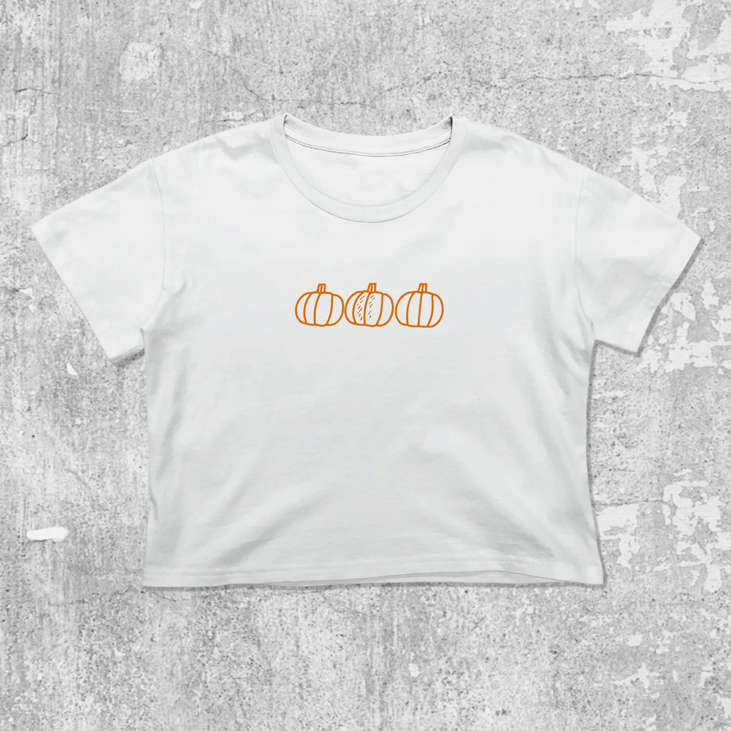 Pumpkins graphic crop tee with cute and trendy fit, featuring playful vintage graphic, stylish cut. White crop t-shirt