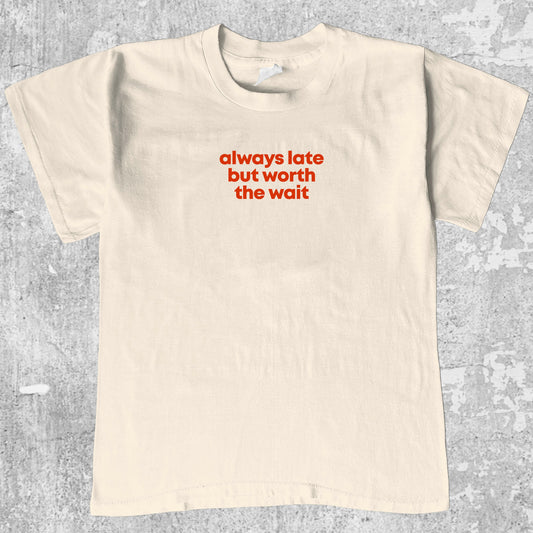 Always late but worth the wait graphic tee with bold and humorous print, funny and trendy graphic. Perfect for Christmas gifts for friends and family. Cream shirt.