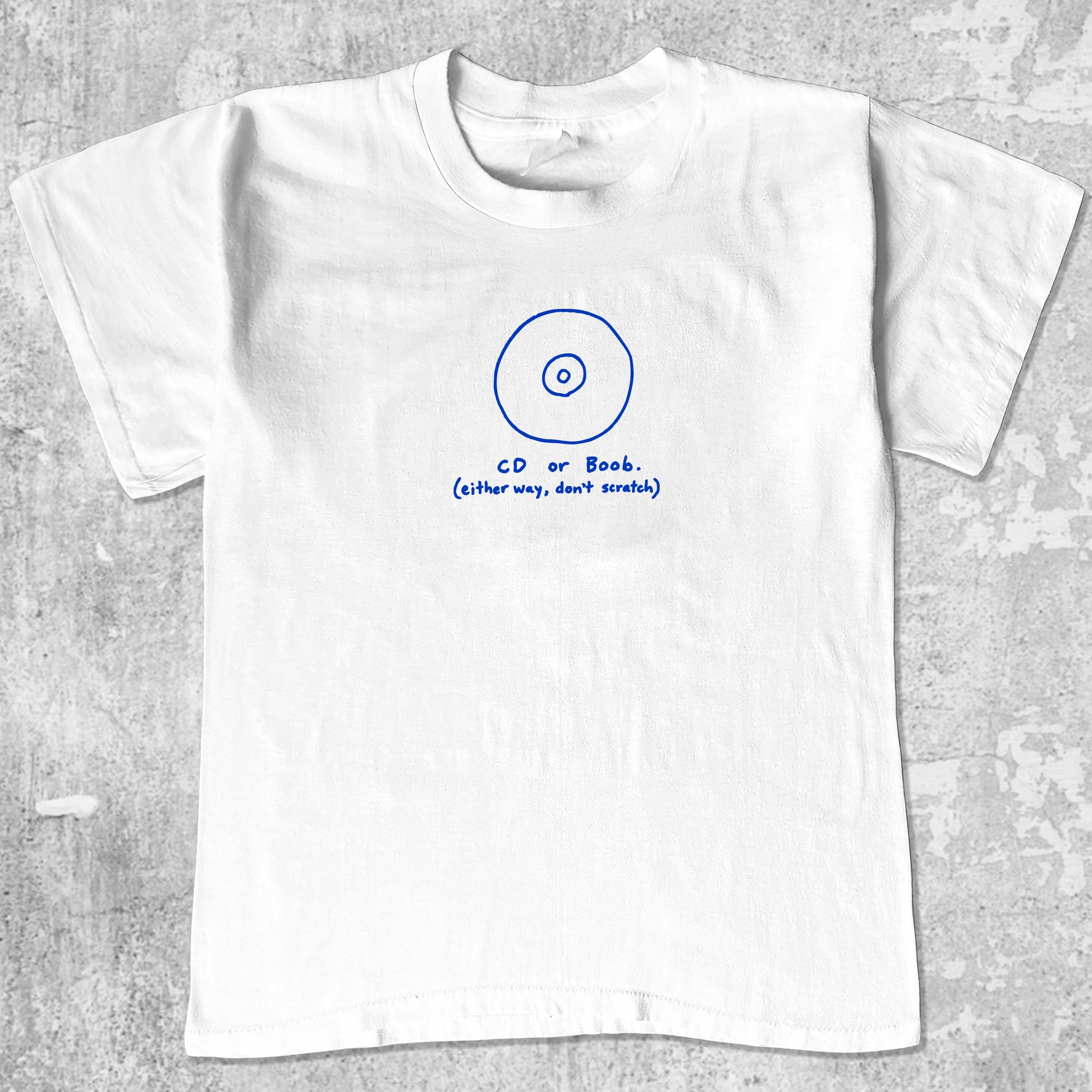 CD or Boob graphic tee with bold and humorous print, funny and trendy graphic. Perfect for adults and gift-giving. White shirt.