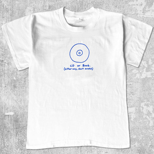 CD or Boob graphic tee with bold and humorous print, funny and trendy graphic. Perfect for adults and gift-giving. White shirt.