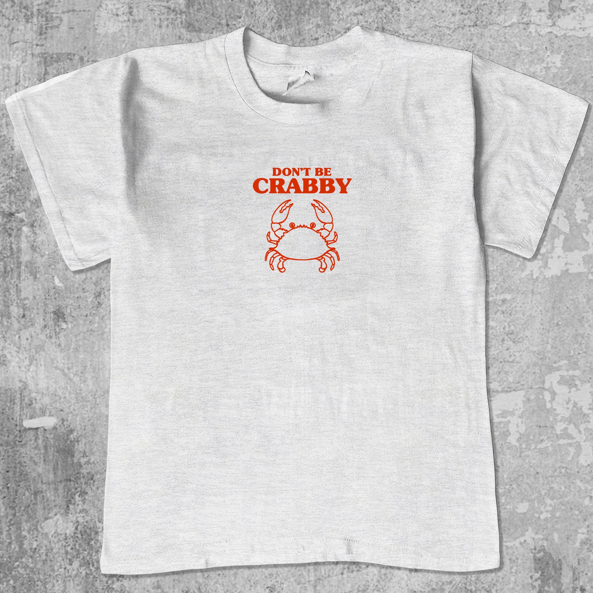 Don't Be Crabby graphic tee with bold and humorous print, funny and trendy graphic. Perfect for adults and gift-giving. Ash Grey shirt.