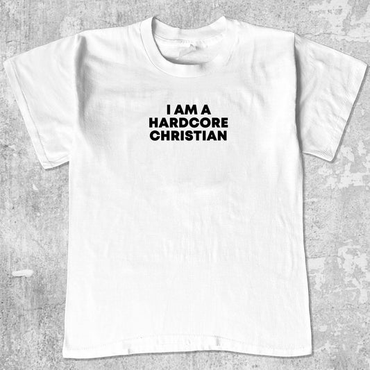 I am a hardcore christian graphic tee with bold and humorous print, funny and trendy graphic. Perfect gifts for friends and family. White shirt.