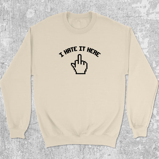 I Hate It Here graphic sweatshirt with bold and humorous print, warm and cozy graphic for everyday wear. Perfect for adults and gift-giving. Natural pullover.