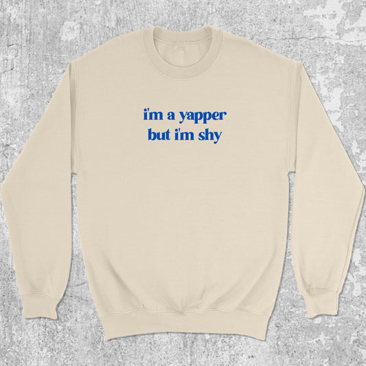 I'm A Yapper But I'm Shy graphic sweatshirt with bold and humorous print, warm and cozy graphic for everyday wear. Perfect gifts for friends and family. Natural pullover.