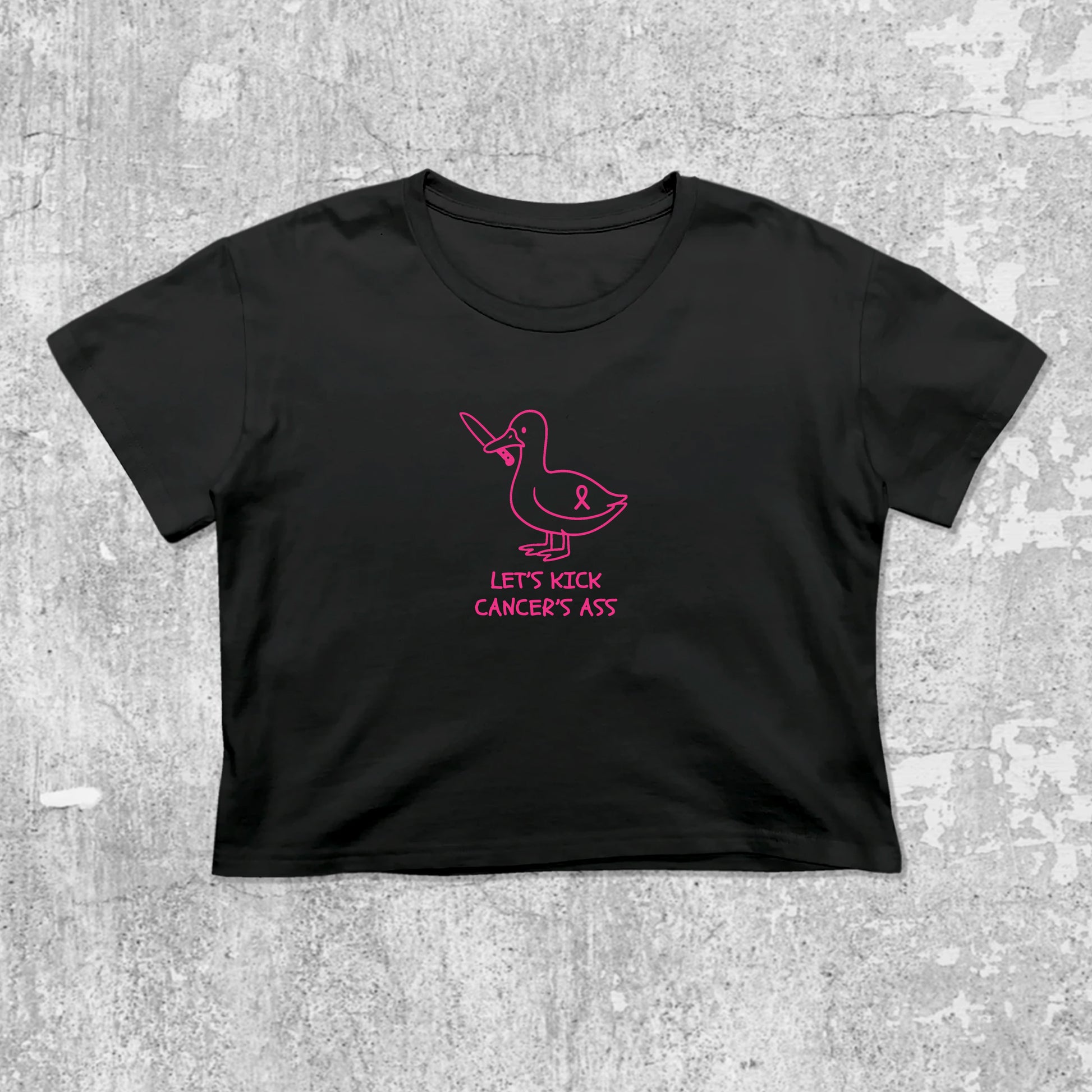 Let's Kick Cancers Ass graphic crop tee with cute and trendy fit, featuring playful vintage graphic, stylish cut. Black crop t-shirt