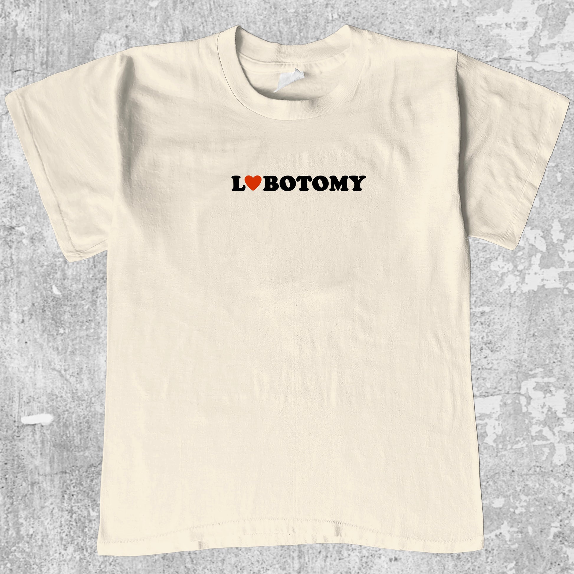 Lobotomy graphic tee with retro and humorous print, funny and trendy graphic. Perfect for adults and gift-giving. Cream shirt.
