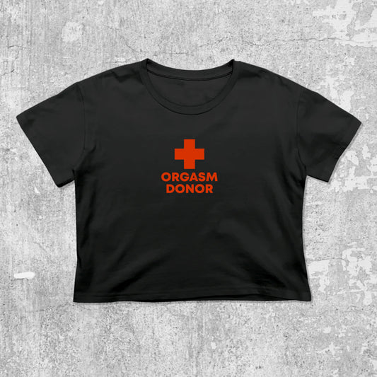 Orgasm Donor graphic crop tee with cute and trendy fit, featuring playful vintage graphic, stylish cut. Black crop t-shirt