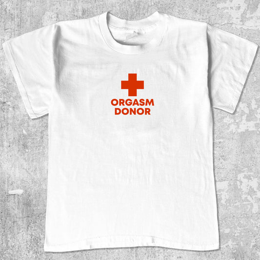 Orgasm Donor graphic tee with bold and humorous print, funny and trendy graphic. Perfect for adults and gift-giving. White shirt.