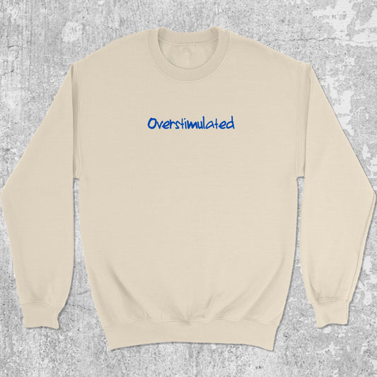 Overstimulated graphic sweatshirt with bold and humorous print, warm and cozy graphic for everyday wear. Perfect gifts for friends and family. Natural pullover.