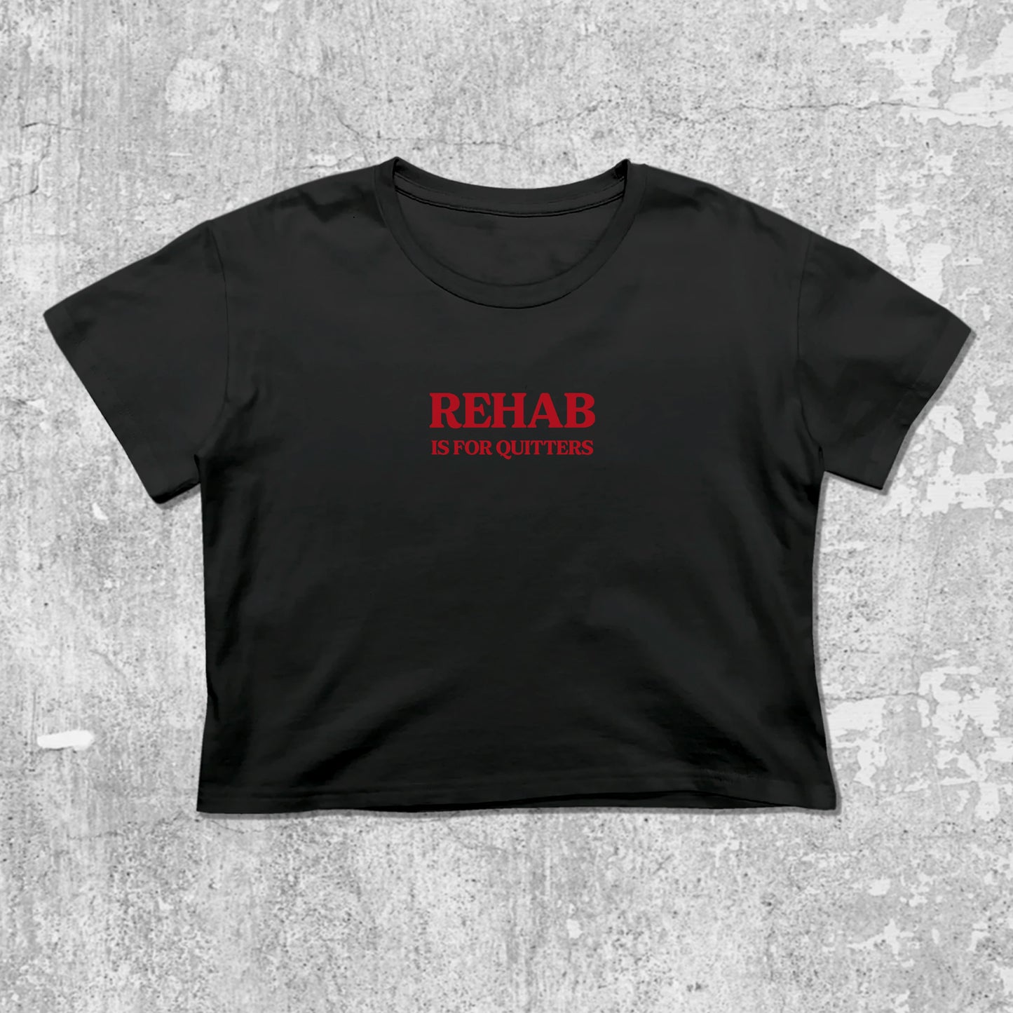 Rehab Is For Quitters graphic crop tee with cute and trendy fit, featuring playful vintage graphic, stylish cut. Black crop t-shirt