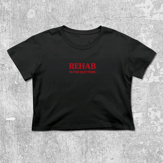 Rehab Is For Quitters graphic crop tee with cute and trendy fit, featuring playful vintage graphic, stylish cut. Black crop t-shirt