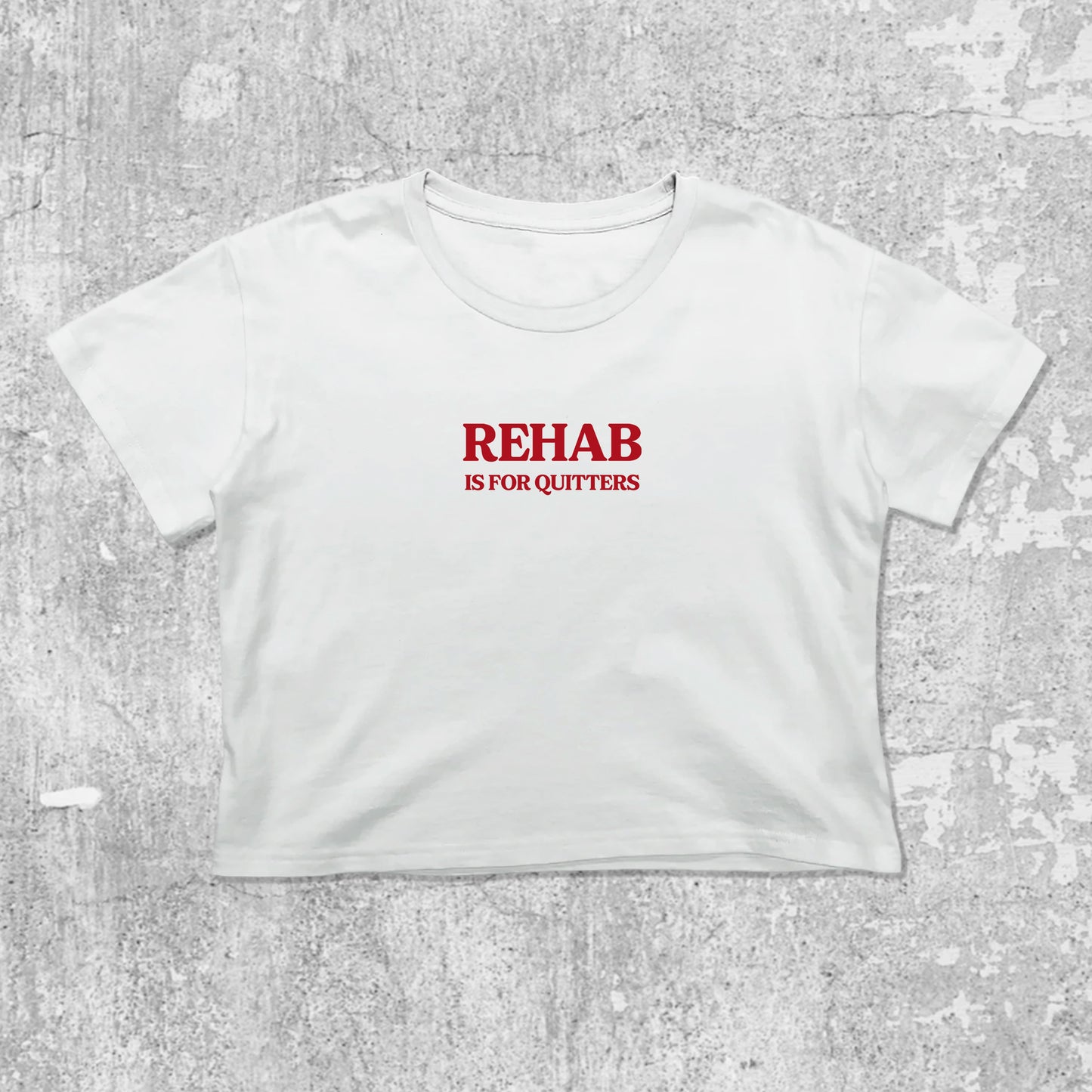 Rehab Is For Quitters graphic crop tee with cute and trendy fit, featuring playful vintage graphic, stylish cut. White crop t-shirt