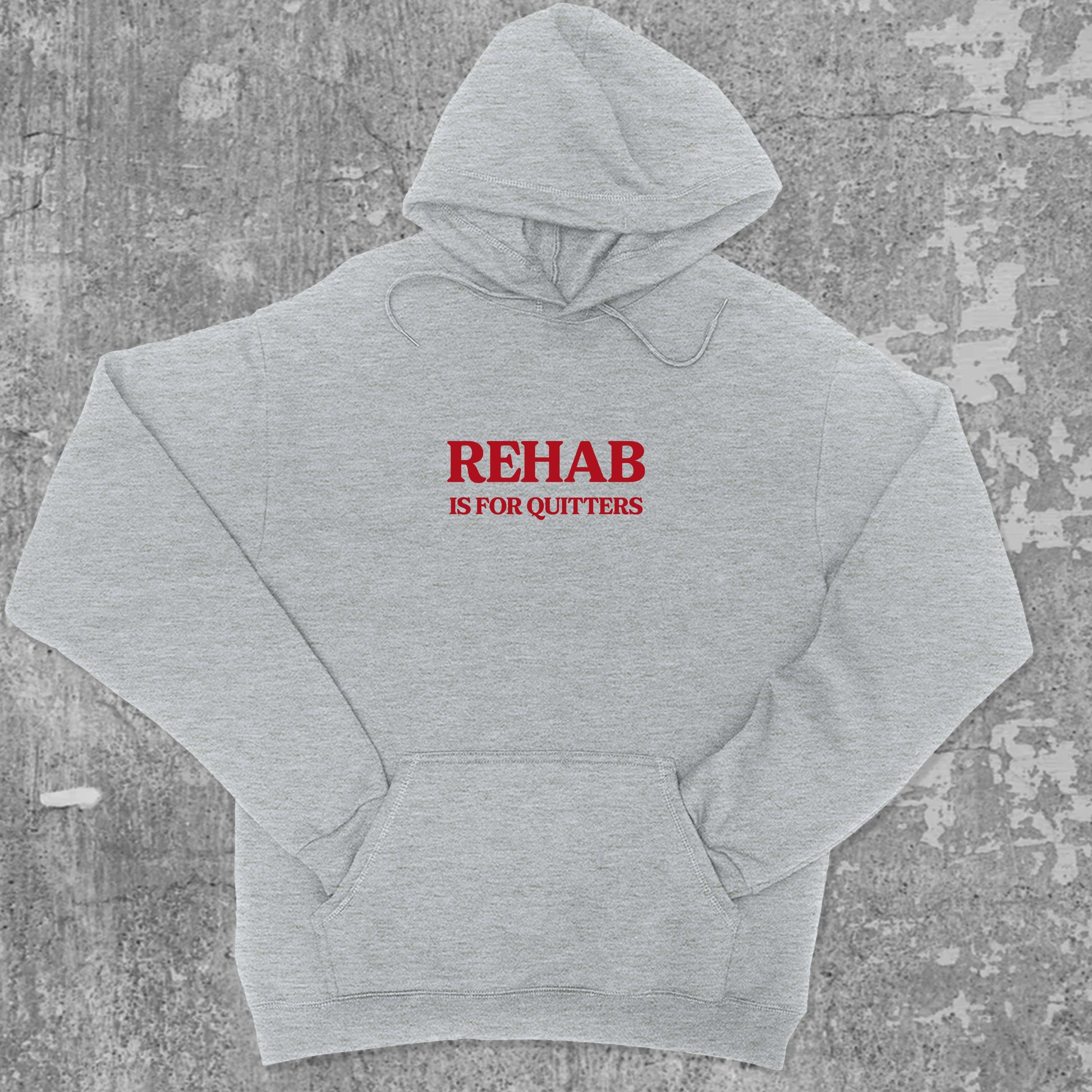 Rehab Is For Quitters graphic hoodie with funny and trendy artwork, casual streetwear with bold personality. Great for adults and gifting. Heather Grey hoodie.