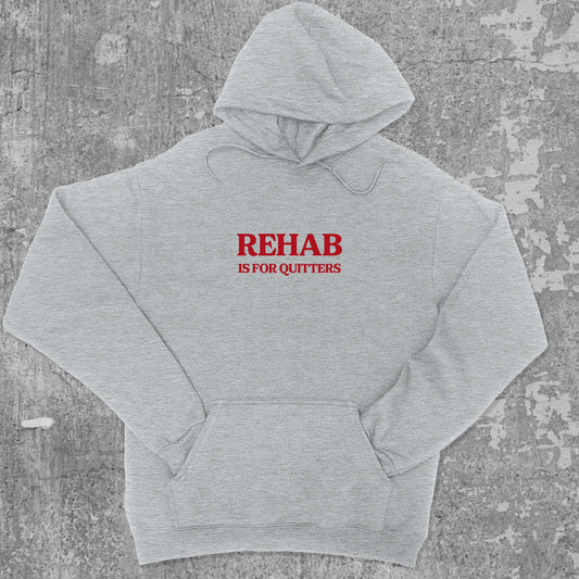 Rehab Is For Quitters graphic hoodie with funny and trendy artwork, casual streetwear with bold personality. Great for adults and gifting. Heather Grey hoodie.