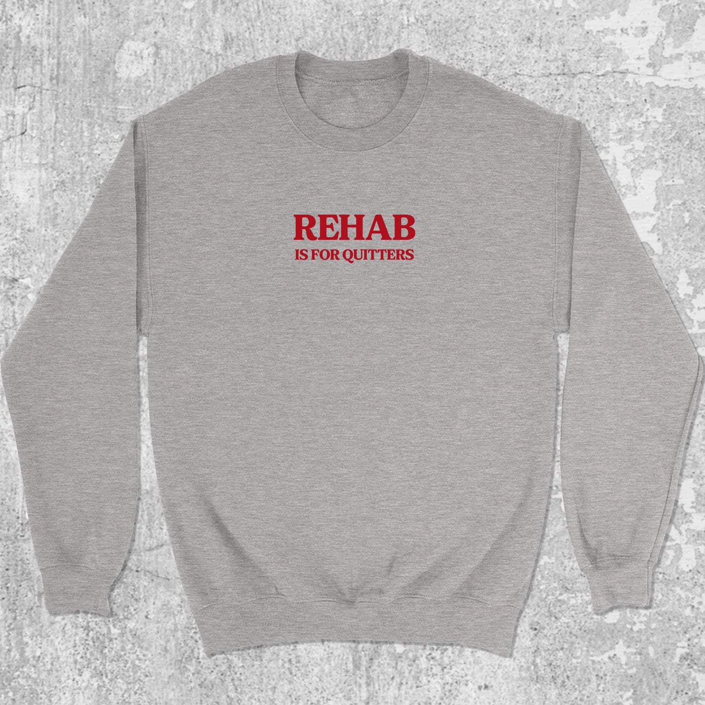 Rehab Is For Quitters graphic sweatshirt with bold and humorous print, warm and cozy graphic for everyday wear. Perfect funny gift for Christmas. Heather Grey pullover.