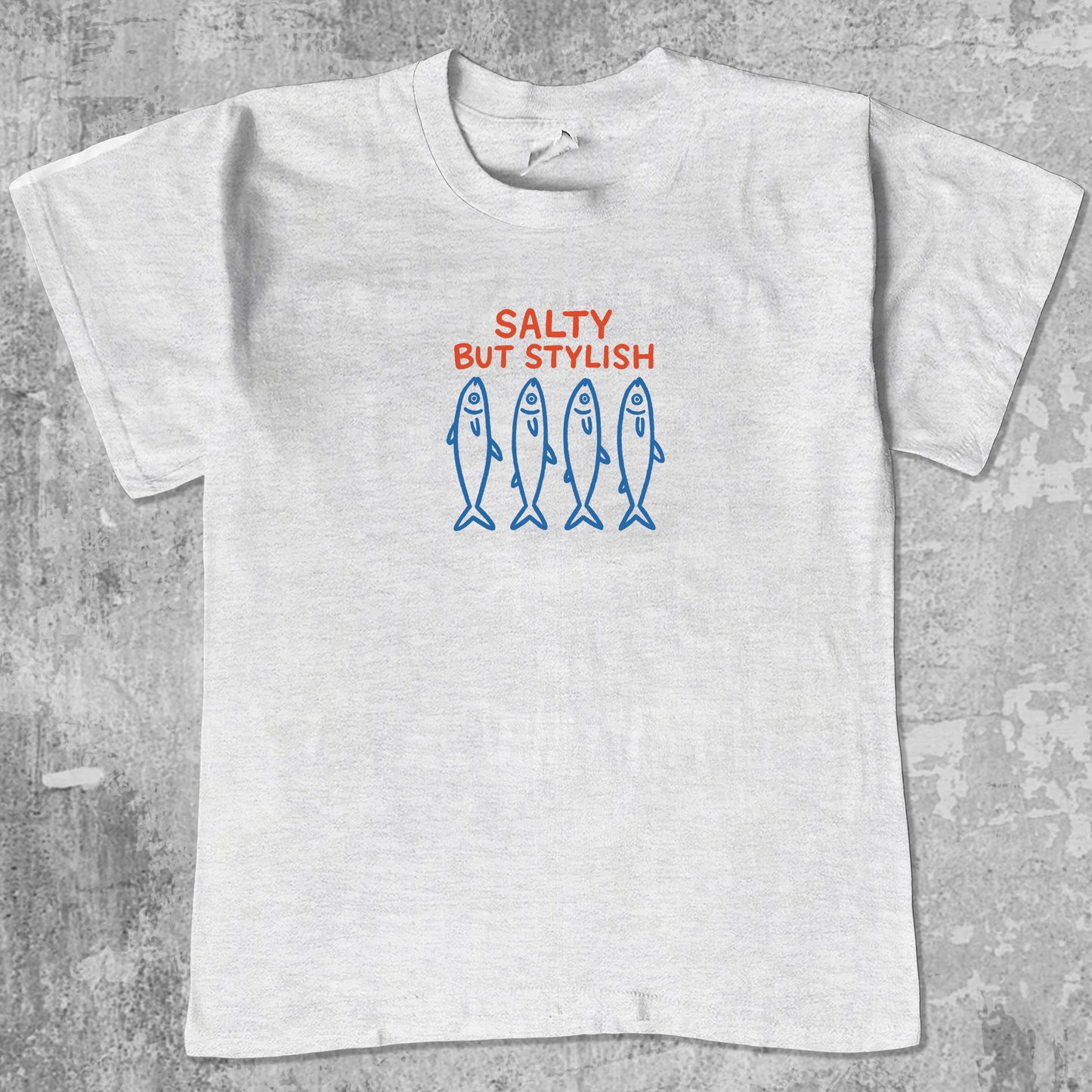 Salty But Stylish graphic tee withfish market graphic, funny and simple graphic. Perfect gifts for family and friends. Ash Grey shirt.