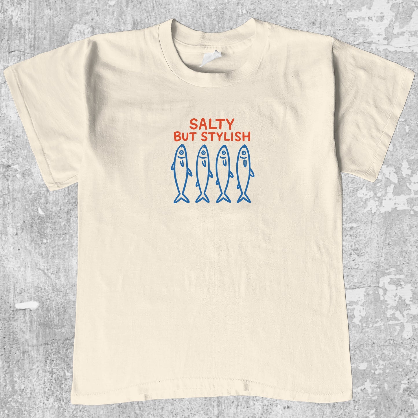 Salty But Stylish graphic tee withfish market graphic, funny and simple graphic. Perfect gifts for family and friends. Cream shirt.