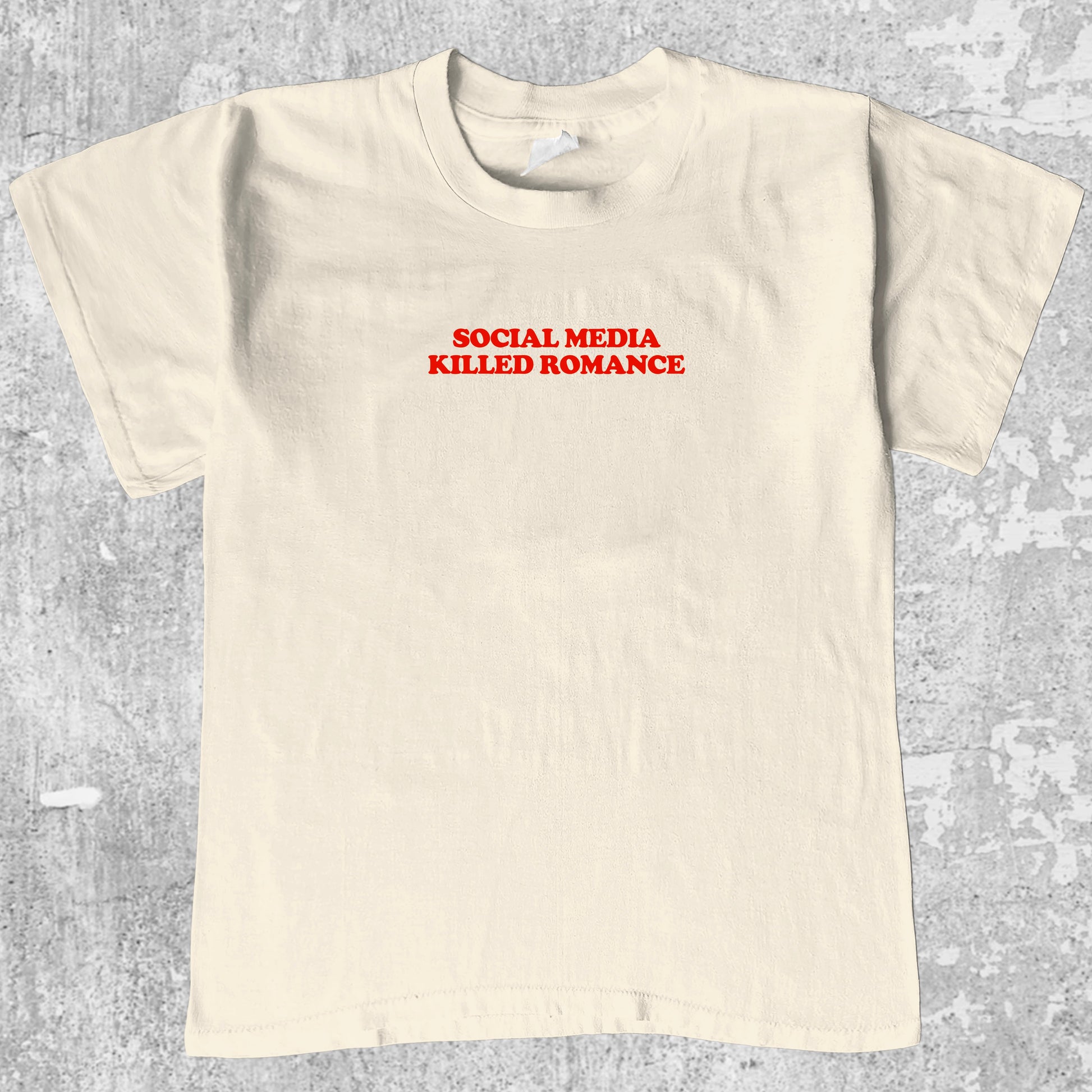 Social Media Killed Romance graphic tee with bold and humorous print, funny and trendy graphic. Perfect for adults and gift-giving. Cream shirt.
