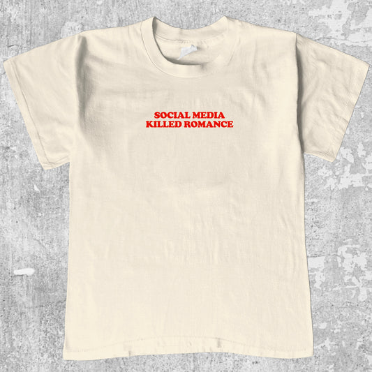 Social Media Killed Romance graphic tee with bold and humorous print, funny and trendy graphic. Perfect for adults and gift-giving. Cream shirt.