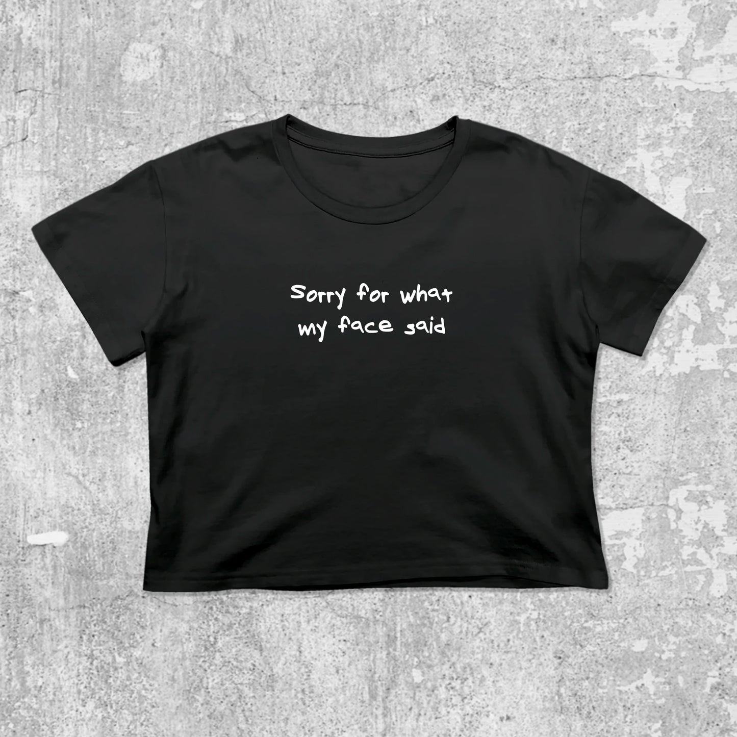 Sorry for what my face said graphic crop tee with cute and trendy fit, featuring playful vintage graphic, stylish cut. Black crop t-shirt