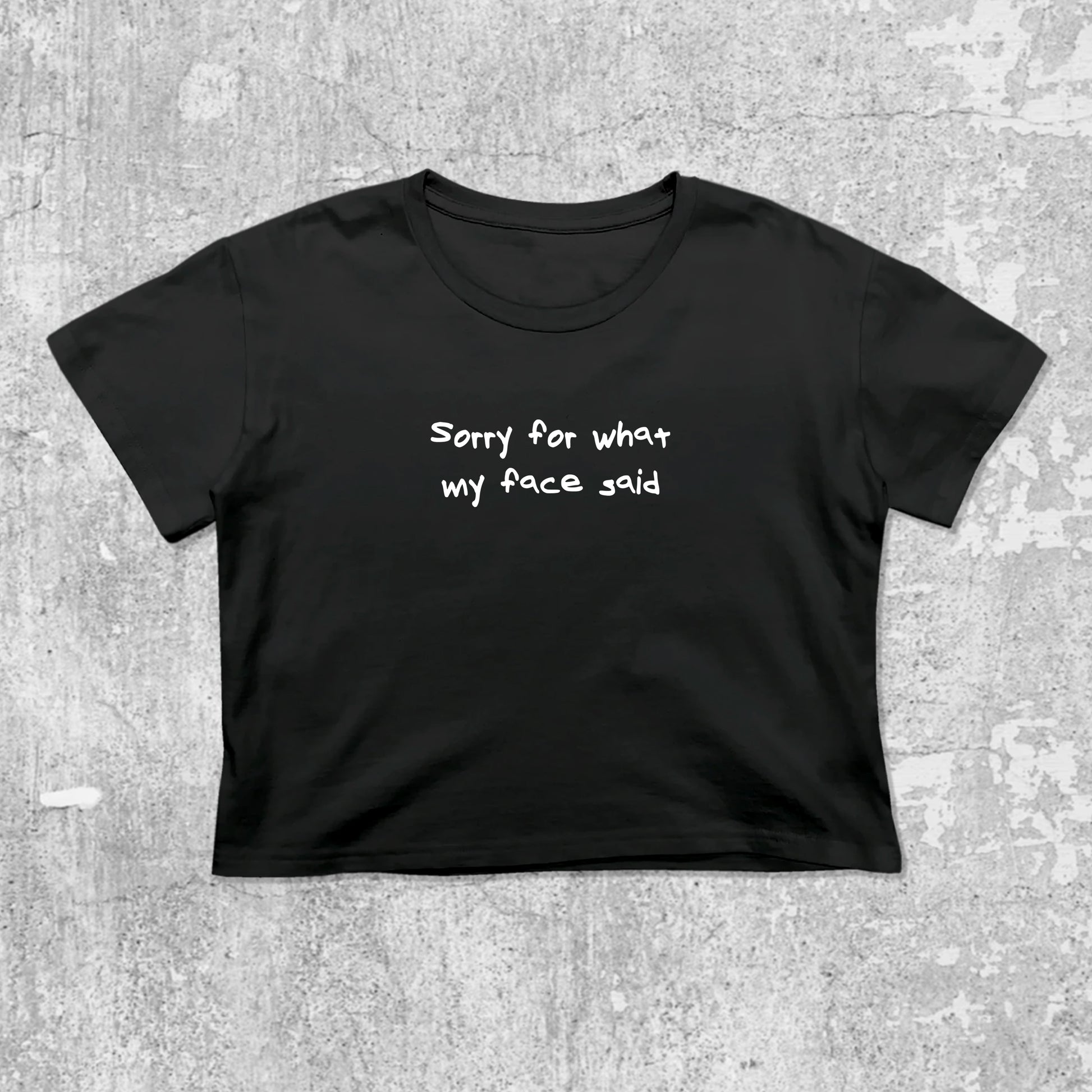 Sorry for what my face said graphic crop tee with cute and trendy fit, featuring playful vintage graphic, stylish cut. Black crop t-shirt