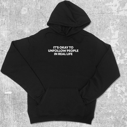 Unfollow People graphic hoodie with funny and trendy artwork, casual streetwear with bold personality. Great for adults and gifting. Black hoodie.