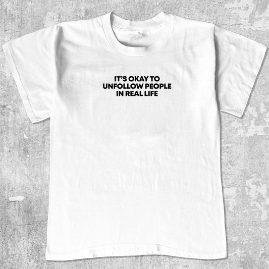 Unfollow People graphic tee with bold and humorous print, funny and trendy graphic. Perfect for adults and gift-giving. White shirt.