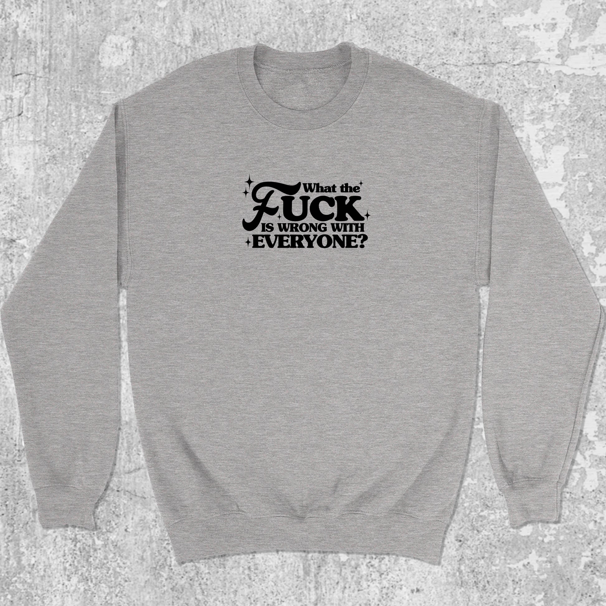 What the fuck is wrong with everyone graphic sweatshirt with bold and humorous print, warm and cozy graphic for everyday wear. Perfect for Christmas gifts for friends and family. Heather Grey pullover.