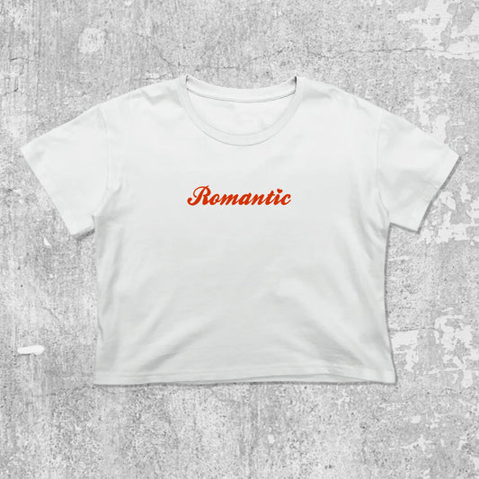 Romantic graphic crop tee with cute and trendy fit, featuring playful vintage graphic, stylish cut. White crop t-shirt