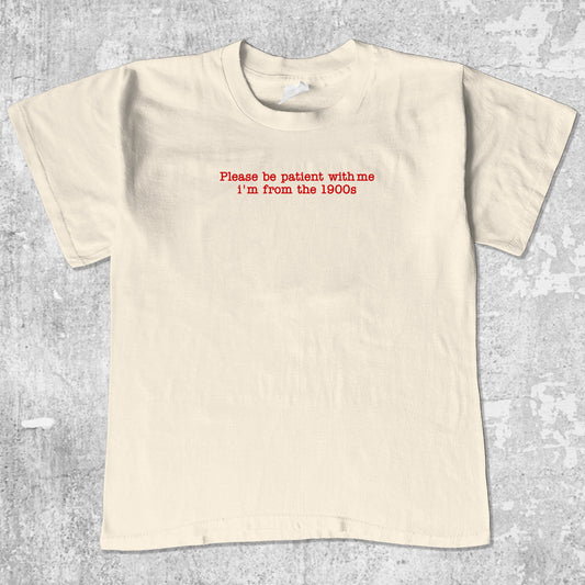 Please Be Patient With Me I'm From The 1900s unisex graphic t-shirt. Vintage trending meme tee. Funny and unique graphic tees. Please Be Patient With Me I'm From The 1900s graphi tee Cream 1