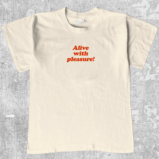 Alive With Pleasure graphic tee with bold and humorous print, funny and trendy graphic. Perfect for adults and gift-giving. Cream shirt.