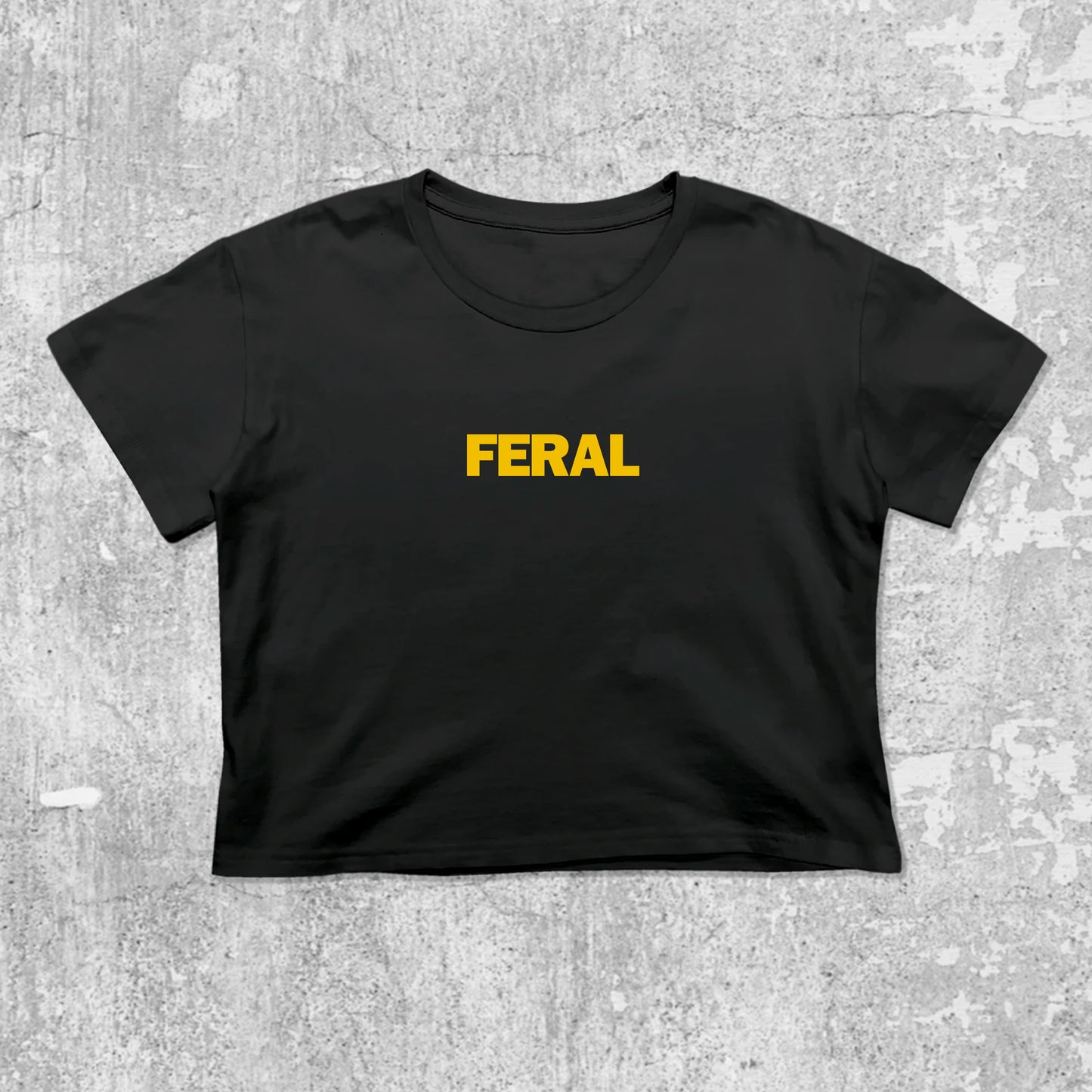 Feral graphic crop tee with cute and trendy fit, featuring playful vintage graphic, stylish cut. Black crop t-shirt