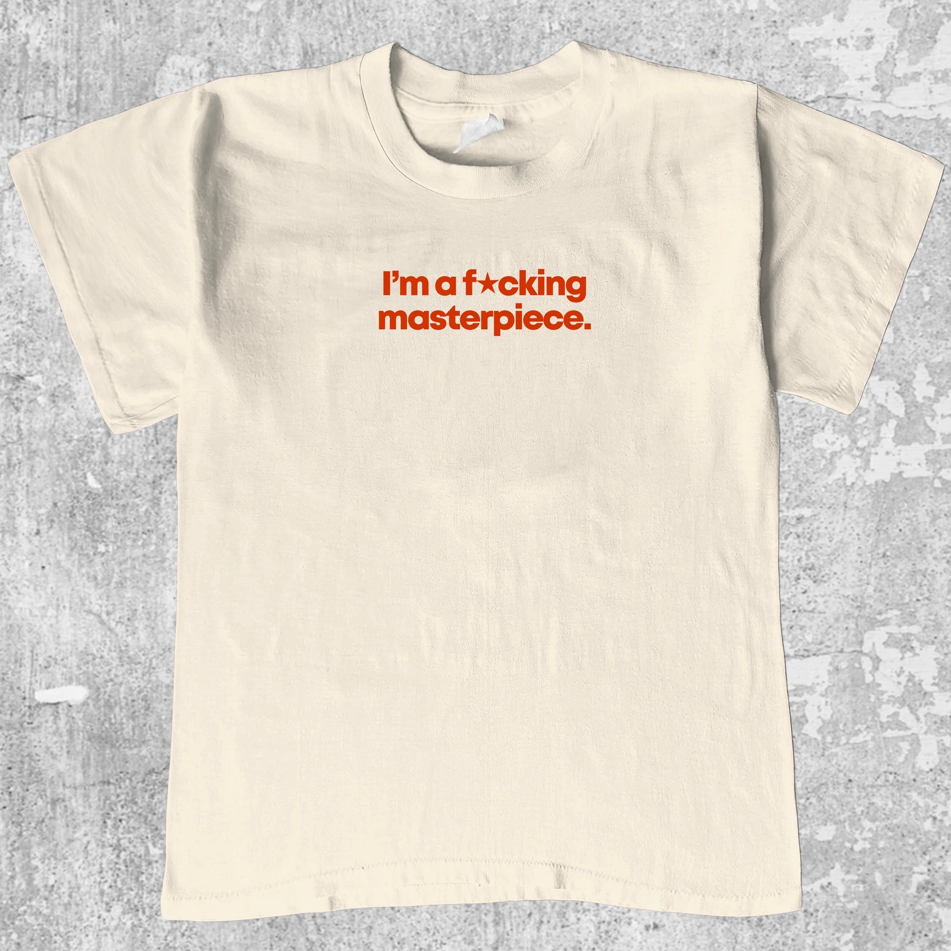I'm A Masterpiece graphic tee with bold and humorous print, funny and trendy graphic. Perfect for adults and gift-giving. Cream shirt.