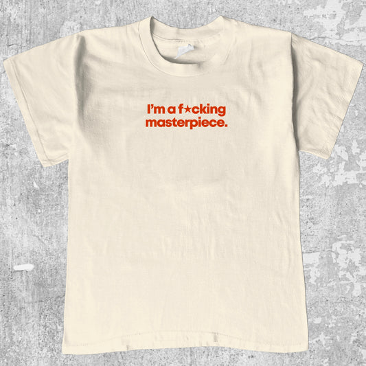 I'm A Masterpiece graphic tee with bold and humorous print, funny and trendy graphic. Perfect for adults and gift-giving. Cream shirt.